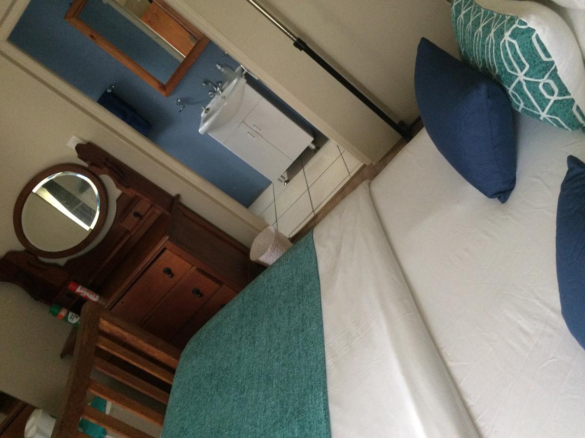 Breeze Inn Guesthouse Kiddʼs Beach Rum bild
